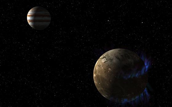 Künstlerische Darstellung: Das Magnetfeld des Jupiter-Mondes Ganymed erzeugt tanzende Polarlichter (blau). Für die Kölner Forscher der Beweis, dass sich unter der Oberfläche ein gigantisches Eismeer befindet.