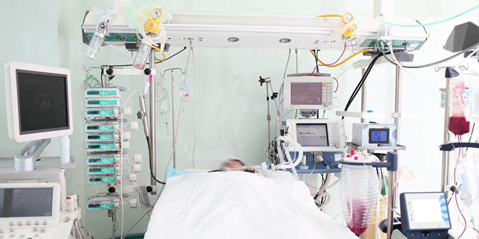bed-intensive care unit with patient
