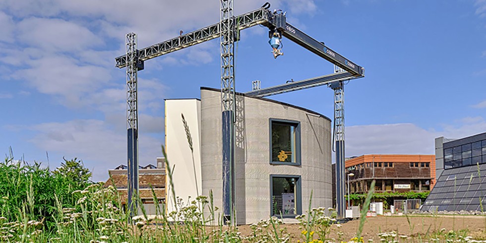 Im Kamp C, dem Landeszentrum für Nachhaltigkeit und Innovation in Antwerpen, entstand ein Einfamilienhaus aus Europas größtem 3D-Drucker. Foto: Kamp C – Jasmien Smets