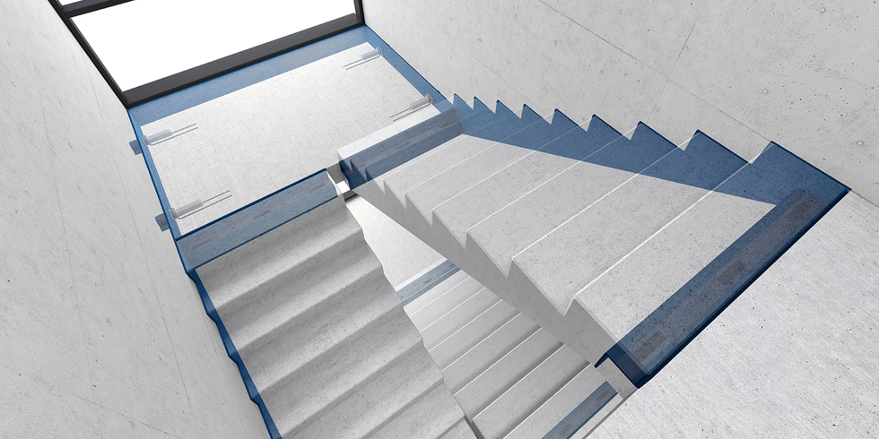 Die aufeinander abgestimmten Varianten der Schöck Tronsole® sorgen für einen effektiven Trittschallschutz im Treppenhaus und ergeben, als System eingebaut, eine blaue Linie, die die Treppe umlaufend umschließt.<br />Foto: Schöck Bauteile GmbH