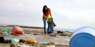 Strong young woman cleaning and volunteering