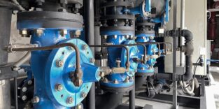 Pump rooms, pipes and valves in large industrial pumping stations