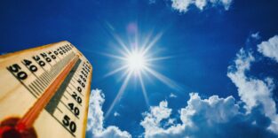 Summer heat, high temperature outdoors, hot desert weather. Thermometer reaching 100 degrees Fahrenheit scale on blue sky background, sunny day. 3d illustration