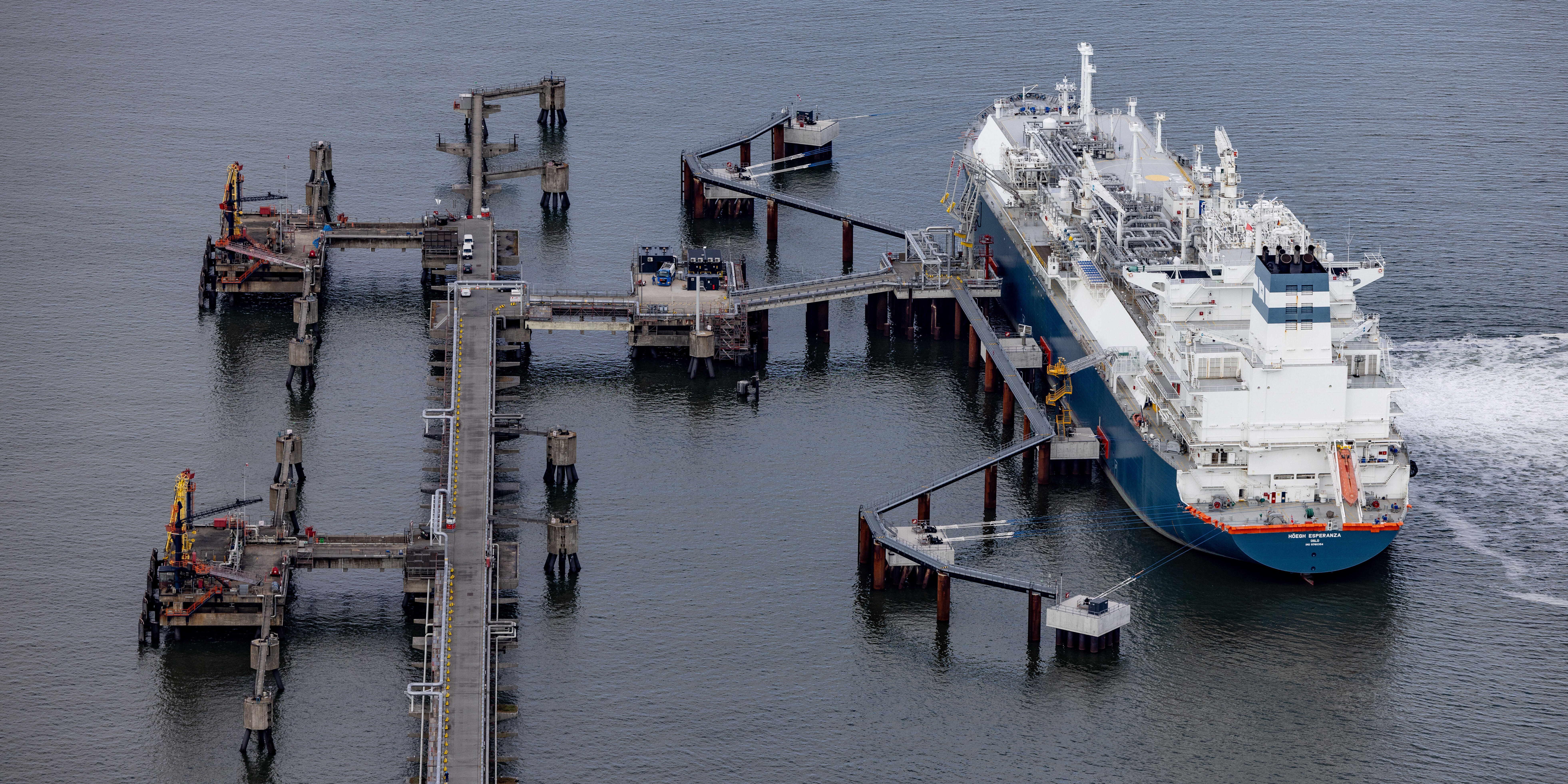 A floating LNG terminal at the Brunsbuttel port. These illustration photos show two floating liquefied natural gas (LNG) terminals in northern Germany, at Brunsbuttel. The vessels that serve as floating terminals can receive highly compressed liquid gas from tankers and convert it into usable gas for distribution through the national gas network to consumers.