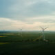 Windmill turbines at sunset, Wind energy concept