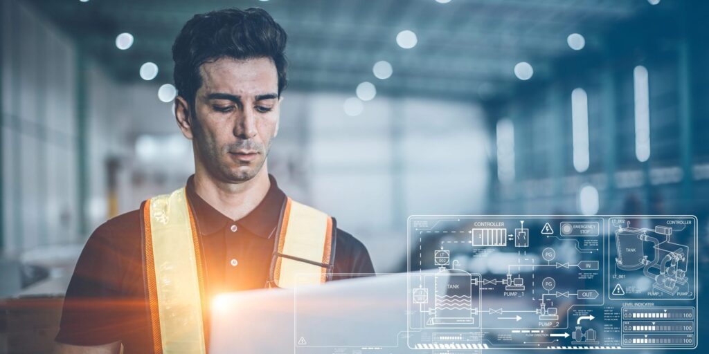 Ingenieur arbeitet mit Laptop-Computer für moderne digitale Computertechnologie zur Steuerung fortschrittlicher Ingenieur-Fabrikabläufe – Informations- und Datenkonzept.